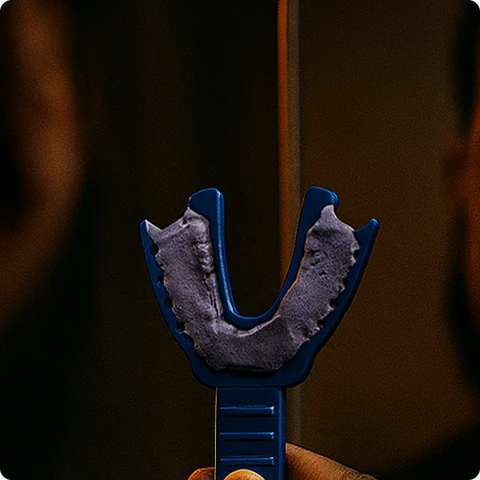 Step 3: Roll the putty into a log and spread it evenly into the upper tray.